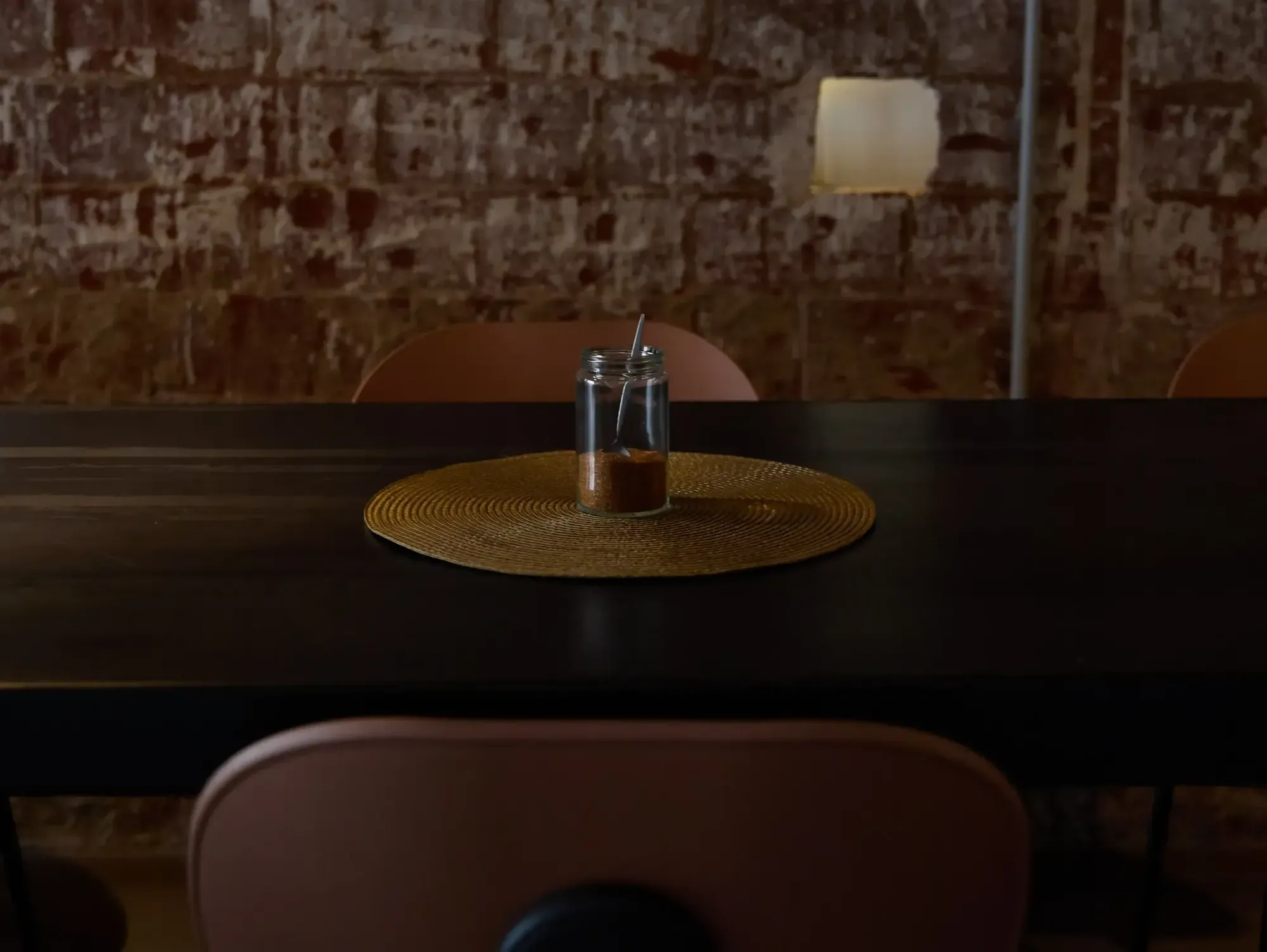 A table at Espai Nu against a brick wall